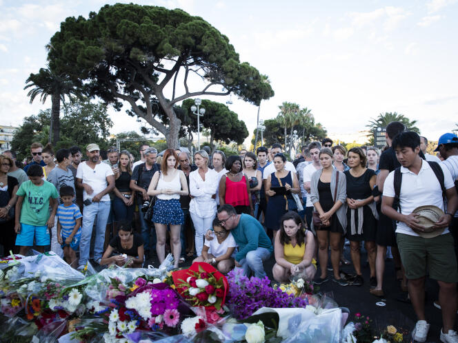 People gather in Nice, the day after the July 14, 2016 attack. 