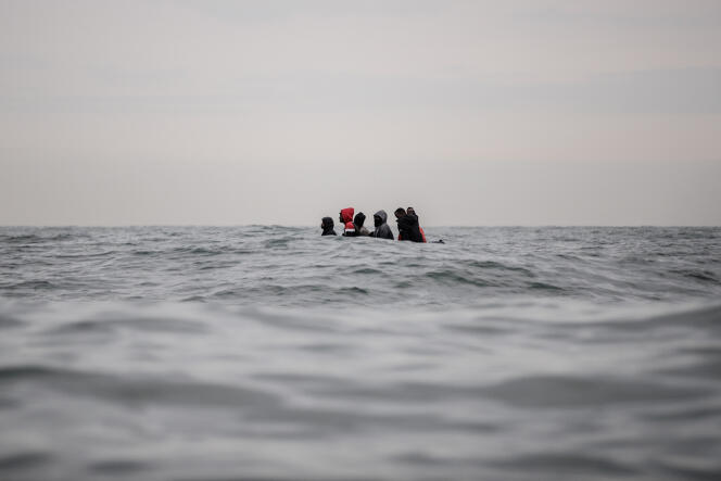 Migrants on a boat travel through rough waters between Sangthe and Cap Blanc-Nez in the English Channel as they try to cross the sea border between France and the United Kingdom on August 27, 2020.