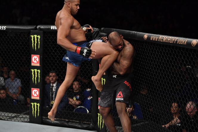 Ciryl Gane lands a flying knee against Don'Tale Mayes in their heavyweight bout during the UFC Fight Night event at the Singapore Indoor Stadium, Singapore on October 26, 2019. 