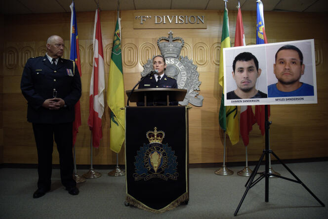 Royal Canadian Mounted Police Assistant Commissioner Rhonda Blackmore at a press conference in Regina, Saskatchewan, Sept. 4, 2022, with portraits of two suspects in knife attacks earlier in the day.