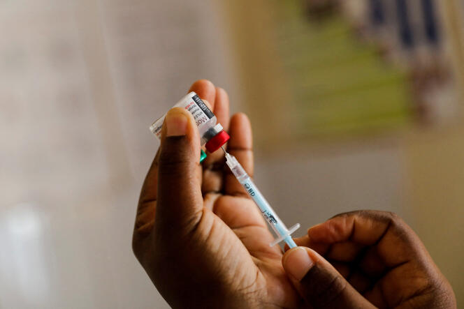 A nurse prepares a dose of a malaria vaccine at a hospital in Kisumu, Kenya on July 1, 2022.
