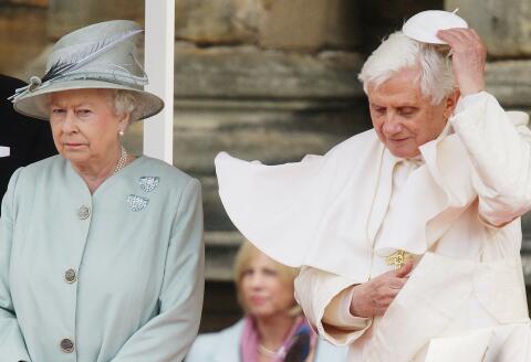 (FILES) In this file photo taken on September 16, 2010 Pope Benedict XVI (R) replaces his 'zucchetto' as he meets with Britain's Queen Elizabeth II at the Palace of Holyroodhouse in Edinburgh, Scotland. From a string of US presidents to Lady Gaga, Queen Elizabeth II met leading political and artistic personalities from around the globe during her record-breaking time on the throne. Some were despised dictators, others world-famous guitarists she made polite conversation with. Regardless of the personalities, she always kept her composure. (Photo by Dave Thompson / POOL / AFP)