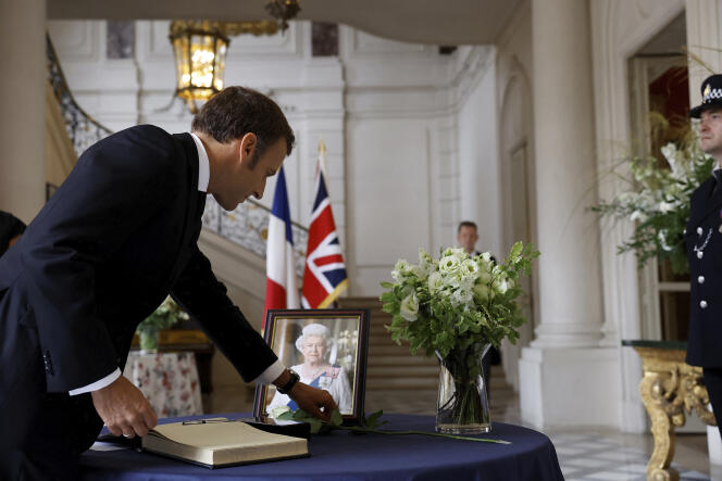 Emmanuel Macron signs the condolence register after the death of Elizabeth II, at the British Embassy in Paris, September 9, 2022.