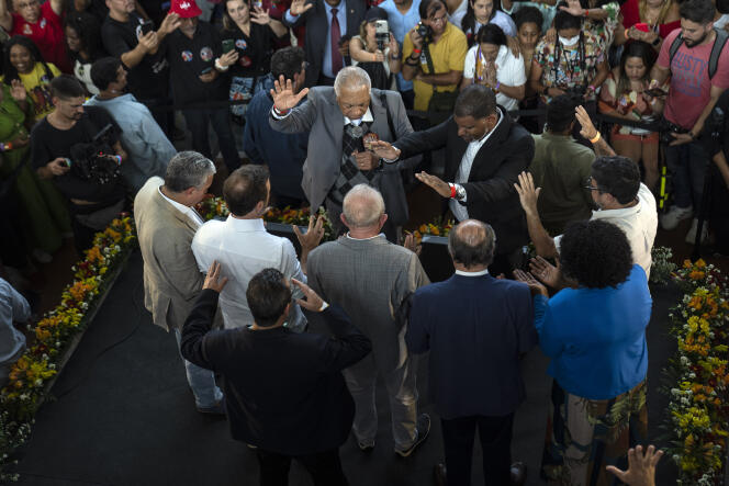 Former Brazilian president Luiz Inacio Lula da Silva, back to camera, center, prays with evangelical pastors and supporters during a political rally in Sao Gonçalo, on the outskirts of Rio de Janeiro, Brazil. September 9, 2022