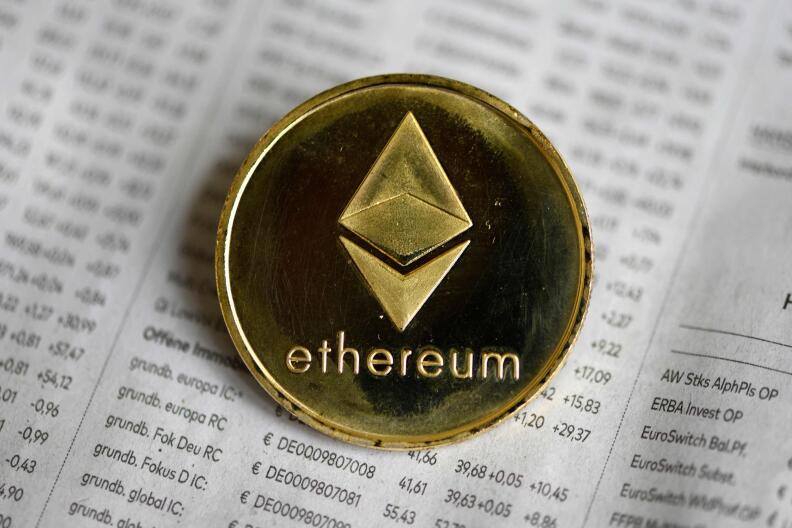 (FILES) In this file photo taken on January 27, 2020 The photo shows a physical imitation of a Ethereum cryptocurrency in Dortmund, western Germany. An army of computer programmers scattered across the globe is set to attempt one of the biggest software upgrades the crypto sector has ever seen later this week. Developers have spent years working on a more energy-efficient version of the ethereum blockchain, a digital ledger that underpins a multibillion dollar ecosystem of cryptocurrencies, digital tokens (NFTs), games and apps. (Photo by INA FASSBENDER / AFP)