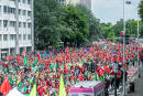Protesters march during a national demonstration of socialist (ABVV-FGTB), christian (ACV-CSC) and liberal (ACLVB-CGSLB) trade unions, to defend purchasing power and demand an amendment to the 1996 wage standards law that regulates wage developments in Belgium, on June 20, 2022, in Brussels. (Photo by JONAS ROOSENS / BELGA / AFP) / Belgium OUT
