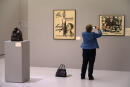 A visitor takes a picture of an engraving by German artist Kathe Kollwitz at the Museum of Modern and Contemporary Art (MAMCS) in Strasbourg, eastern France, on October 3, 2019. (Photo by PATRICK HERTZOG / AFP) / RESTRICTED TO EDITORIAL USE - MANDATORY MENTION OF THE ARTIST UPON PUBLICATION - TO ILLUSTRATE THE EVENT AS SPECIFIED IN THE CAPTION