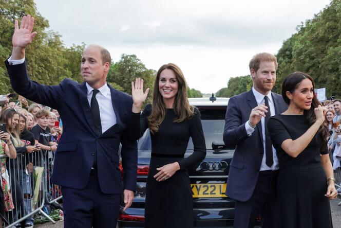 (L-R) Britain's Prince William, Prince of Wales, Britain's Catherine, Princess of Wales, Britain's Prince Harry, Duke of Sussex, Britain's Meghan, Duchess of Sussex, wave at well-wishers on the Long walk at Windsor Castle on September 10, 2022.