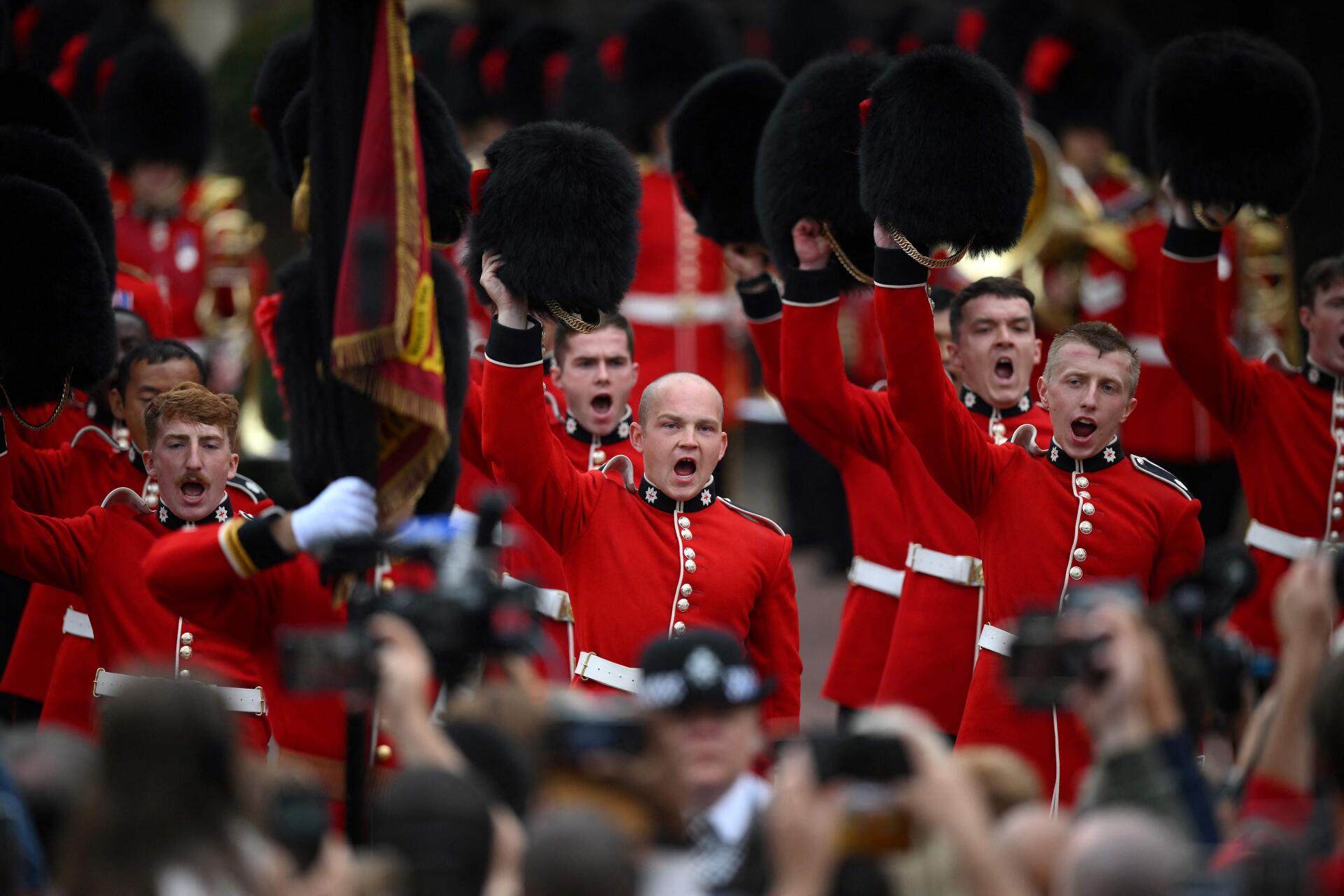 Members of the Coldstream Guards raise their hats to greet the new king in Friary Court at St James's Palace in London on September 10, 2022.