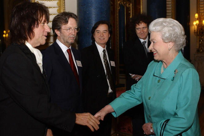 Queen Elizabeth II greets guitarists (left to right) Jeff Beck, Eric Clapton, Jimmy Page and Brian May during a reception at Buckingham Palace, London, March 1, 2005.