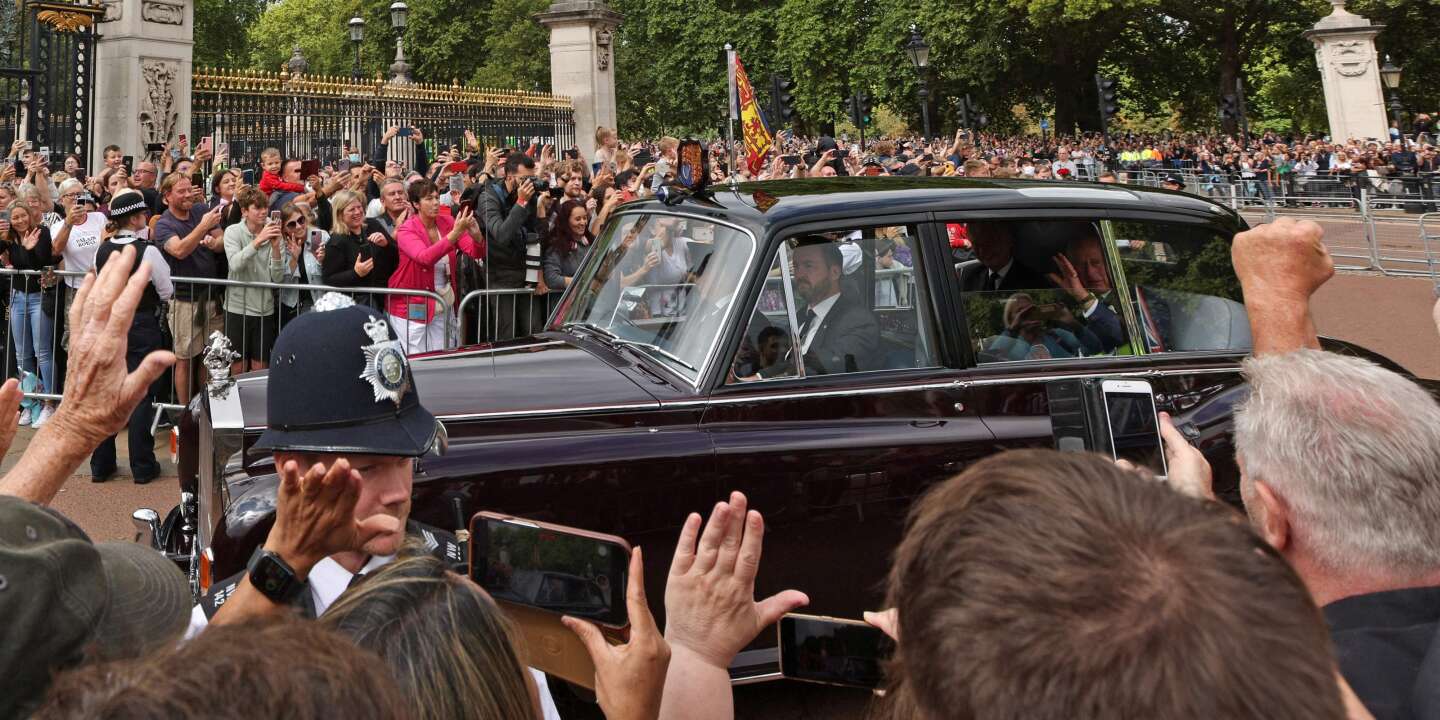 Officially crowned King, Charles III returned to Buckingham Palace to applause