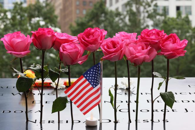 Flowers on the names of the victims of the 9/11 terror attack, during the annual 9/11 memorial service, September 11, 2022, at the Manhattan Memorial Museum in New York City.