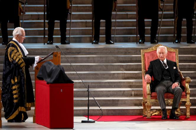 Lord Speaker John McFall, left, delivers a speech as Britain's King Charles III sits in Westminster Hall, where both Houses of Parliament meet to express their condolences after Queen Elizabeth II's death, in Westminster Hall, London, Monday 12 September 2022. Queen Elizabeth II, Britain's longest-serving reigning monarch, died Thursday after seventy years on the throne.