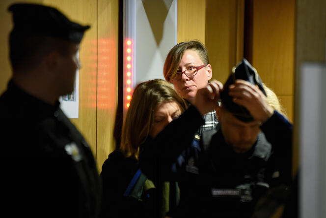 Emily Spanton (center) leaving the hearing on January 14, 2018, in Paris. 