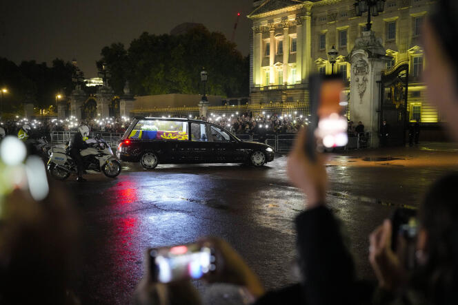 The hearse carrying the coffin of Queen Elizabeth II arrives at Buckingham Palace in London on Tuesday, September 13, 2022.