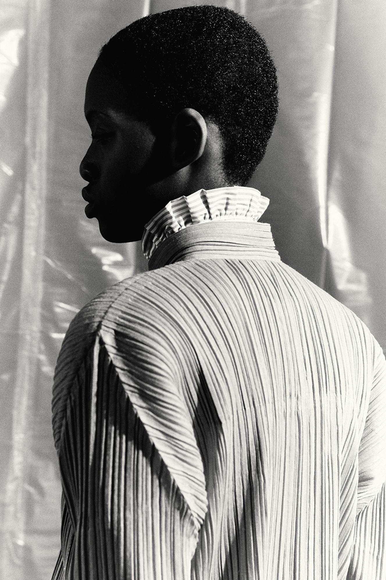 Polyester jacket, pleats please Issey Miyake, €630. isseymiyake.com Cotton poplin Edith shirt, Figuret, €145. figaret.com