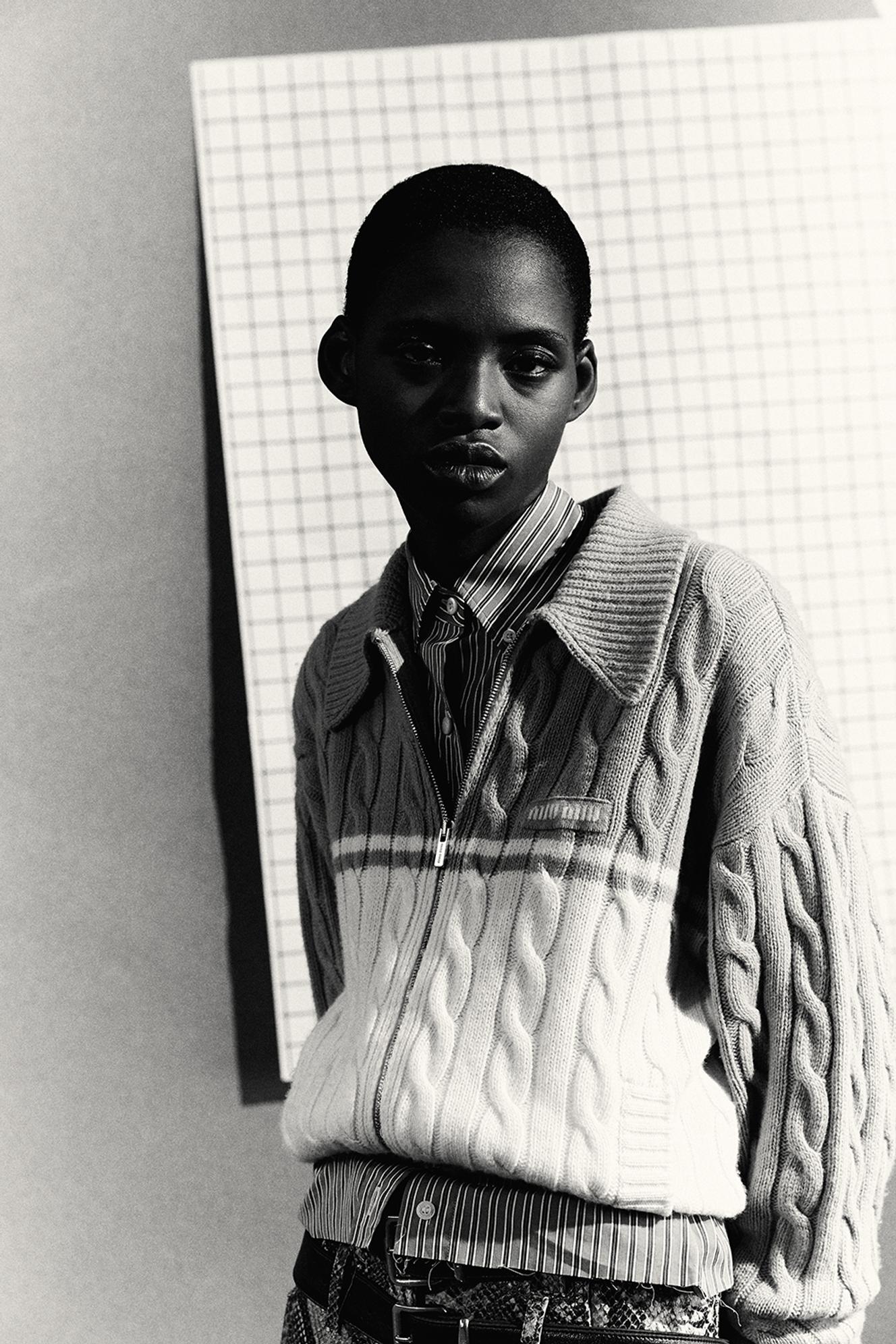 Wool and cashmere cardigan and cotton shirt, €1,400 and €750, leather trousers and belt, Miu Miu. miumiu.com