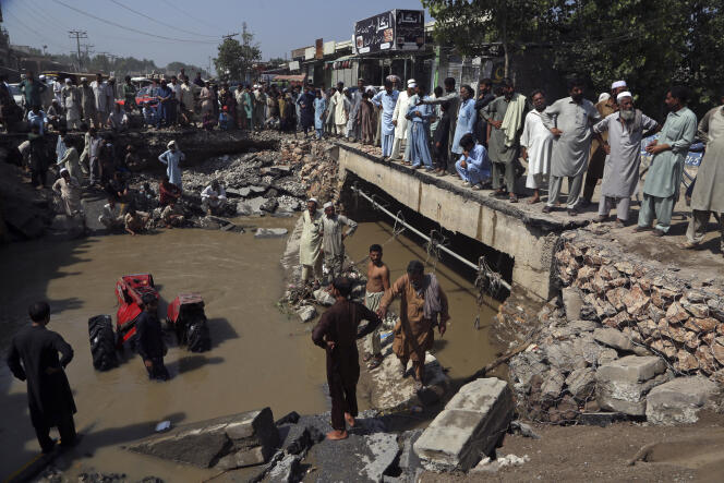 Around a dilapidated road after heavy rains in Charsadda, Pakistan, Tuesday, August 30, 2022.