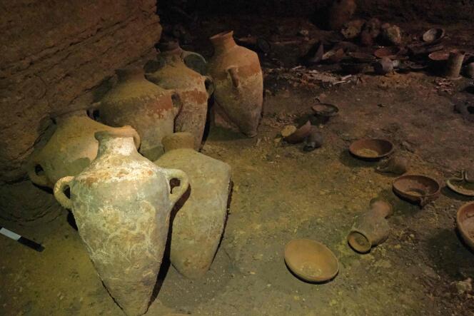 A handout picture provided by the Israel Antiquities Authority on September 18, 2022, shows finds including pottery vessels, dating back to the thirteenth century BCE during the rule of Egypt's Pharaoh Rameses II, discovered untouched in a funerary cave at the central Palmachim park area on the Mediterranean coast. 
