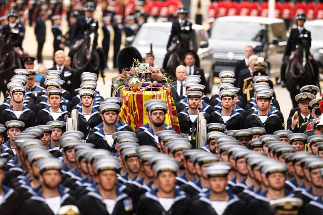 Royal Navy officers and sailors carry the coffin of Queen Elizabeth II to Westminster Abbey in London on September 19, 2022.