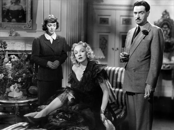 Eve Gill (Jane Wyman), Charlotte Inwood (Marlene Dietrich) and Inspector Wilfred Smith (Michael Wilding) in
