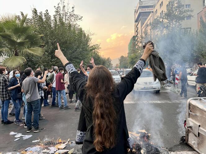 People demonstrate in central Tehran on September 19, in reaction to the death of Mahsa Amini three days earlier