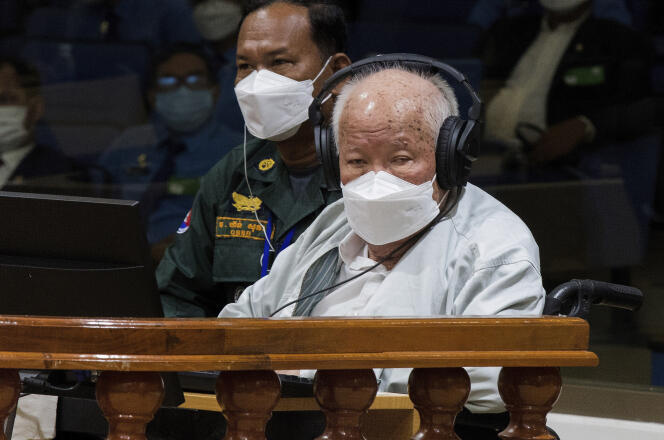 In this photo released by Extraordinary Chambers of the Cambodian Courts, Kew Champon sits in a courtroom in Phnom Penh, Cambodia, Thursday, Sept. 22, 2022. 