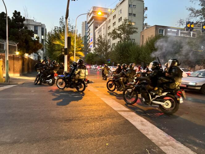 Riot police disperse a crowd during a demonstration against the death of Mahza Amini in central Tehran, Iran, on September 19.