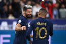 France's forward Olivier Giroud (L) embraces teammate France's forward Kylian Mbappe after scoring during the UEFA Nations League, League A Group 1 football match between France and Austria at Stade de France in Saint-Denis, north of Paris, on September 22, 2022. (Photo by FRANCK FIFE / AFP)
