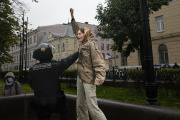 A police officer holds a demonstrator during a protest in Moscow, Russia, on September 24, 2022. 