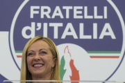 Giorgia Meloni speaks to the media at her party's electoral headquarters in Rome, on Sunday, Sept. 25, 2022.