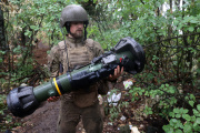 A Ukrainian soldier holds a new generation light anti-armor weapon (NLAW), not far from the Kharkiv frontline, July 11, 2022.