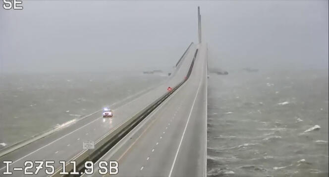 This photo provided by the Florida Department of Transportation shows an emergency vehicle traveling on the Sunshine Skyway in Tampa Bay, Wednesday, Sept. 28, 2022. 