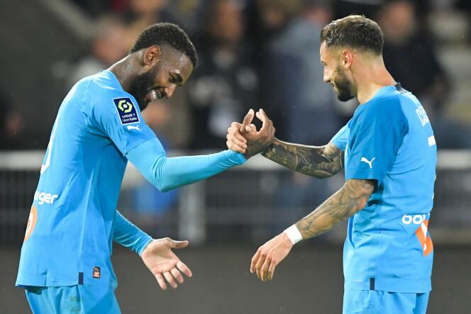 Marseille players Gerson and Jonathan Klaus congratulate each other after his goal against Angers, who was playing at home, on September 30, 2022.
