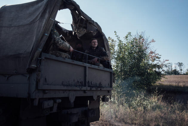 A truck carrying Ukrainian troops on a road recently retaken from the Russians in Donetsk Oblast on September 29, 2022.
