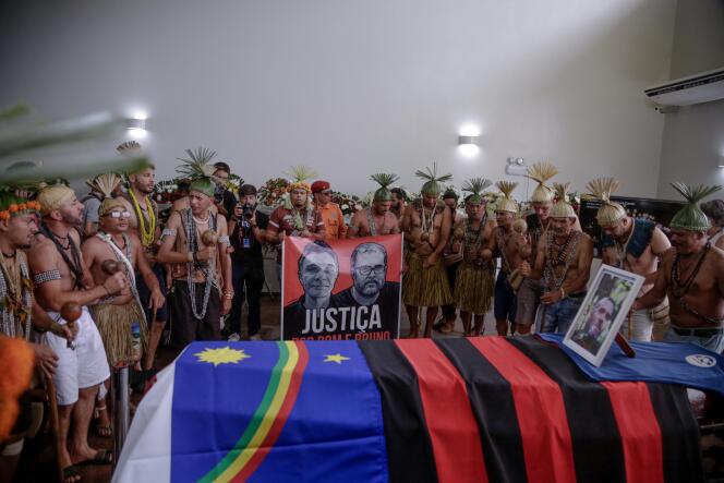 Members of the Xukuru people chant a sacred prayer in honor of Brazilian Bruno Pereira during his funeral at the Morada da Paz cemetery in Paulista, Brazil. June 24, 2022.