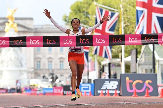 Ethiopia's Yalemzerf Yehualaw runs to the line to win the women's race at the finish of the 2022 London Marathon in central London on October 2, 2022.  