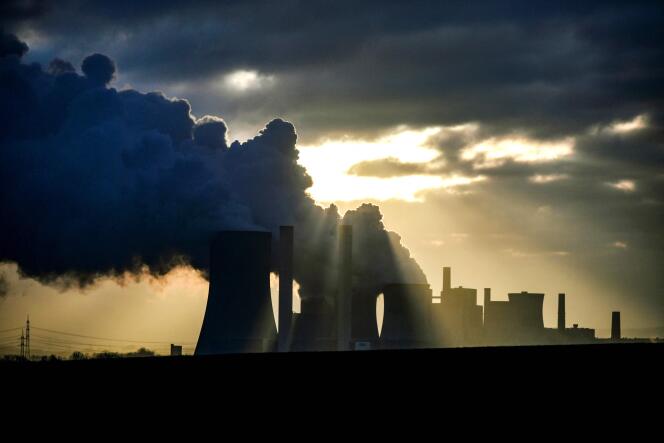 (FILES) In this file photo taken on January 17, 2022 steam rises from the cooling towers of the lignite-fired power plant of German energy giant RWE in Niederaussem, western Germany.