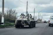 Two Ukrainian armored vehicles driving through the city of Sloviansk, Ukraine, on October 3, 2022.
