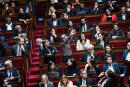 Paris, France le 4 octobre 2022 - Seance des Questions au gouvernement, a l Assemblee nationale, du 4 octobre. La depute Ecologiste se leve et fait un signe feministe de ses mains, imitant une vulve, tandis que de nombreux deputes Renaissance se levent pour applaudir la prise de parole d Aurore Berge.