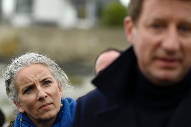 MP Delphine Batho listens to presidential candidate of the ecologist party Europe Ecologie Les Verts (EELV) Yannick Jadot near Saint-Brieuc, in northwestern France, on March 29, 2022, during a campaign visit.
