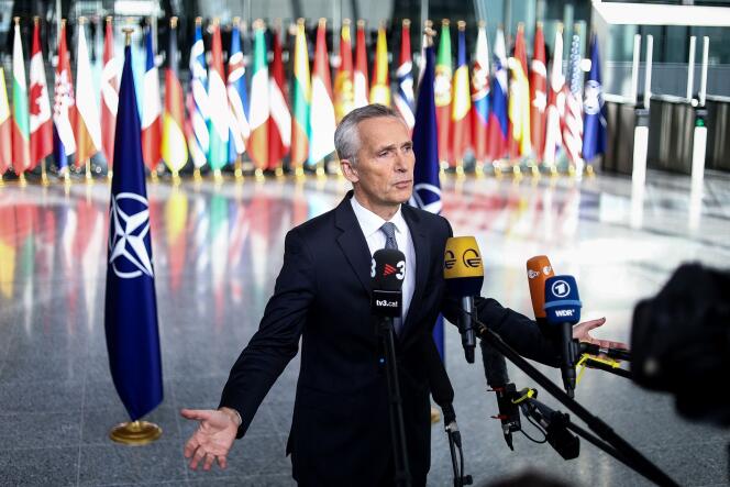 NATO Secretary General Jens Stoltenberg addresses the press as he arrives at the organization's headquarters in Brussels for the two-day meeting of defense ministers of the Atlantic Alliance member states, October 12, 2022.  