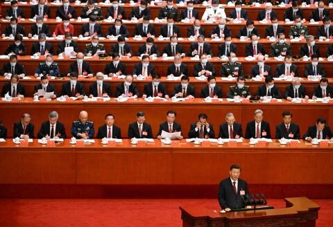 China's President Xi Jinping (R) speaks during the opening session of the 20th Chinese Communist Party's Congress at the Great Hall of the People in Beijing on October 16, 2022. (Photo by Noel CELIS / AFP)