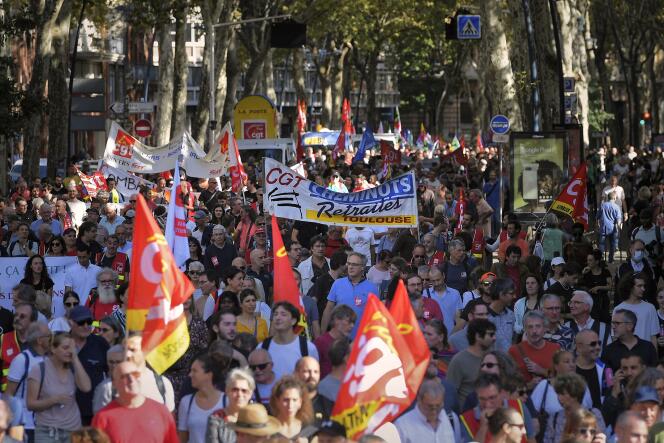 Protesters march during a demonstration in Toulouse, southwestern France, on October 18, 2022. The CGT and FO trade unions called for a nationwide strike for higher salaries and against the government's requisitioning of fuel refineries to force some strikers back into opening fuel depots.