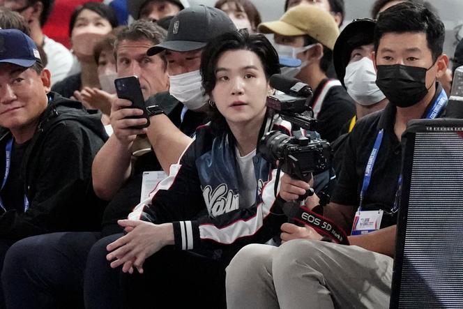 BTS member Suga attends a game between the Golden State Warriors and the Washington Wizards, two American basketball teams, on September 30, 2022, at Saitama Super Arena, north of Tokyo.