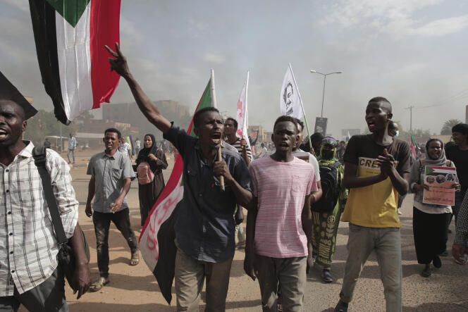 Sudanese demonstrators attend a rally to demand the return to civilian rule nearly a year after a military coup led by Gen. Abdel Fattah al-Burhan, in Khartoum, Sudan, Friday, Oct. 21, 2022.