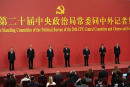 New members of the Politburo Standing Committee, from left, Li Xi, Cai Qi, Zhao Leji, President Xi Jinping, Li Qiang, Wang Huning, and Ding Xuexiang are introduced at the Great Hall of the People in Beijing, Sunday, Oct. 23, 2022. (AP Photo/Ng Han Guan)