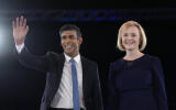 FILE - Liz Truss, right, and Rishi Sunak on stage after a Conservative leadership election hustings at Wembley Arena in London, Wednesday, Aug. 31, 2022. Sunak ran for Britain’s top job and lost. Now he’s back with a second chance to become prime minister. (AP Photo/Kirsty Wigglesworth, File)