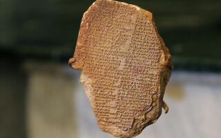 The Gilgamesh Tablet, a 3,500-year-old Mesopotamian cuneiform clay tablet that was believed to be looted from Iraq around 1991 and illegally imported into the US to be displayed at the Washington Museum of the Bible, is displayed in the Iraqi Ministry of Foreign Affairs in the capital Baghdad on December 7, 2021 after its repatriation. - The tablet was exhibited to the media in Iraq today by the authorities who welcomed its return as a "victory" against those who stole the country's "history". (Photo by Sabah ARAR / AFP)