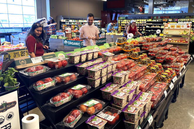 People shop at a grocery store in Glenview, Illinois, United States, on July 4, 2022.  